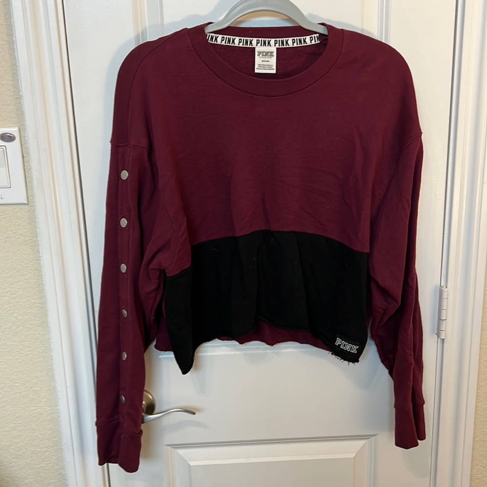Maroon lightweight sweatshirt by PINK. Cropped style. Snap detail on sleeve